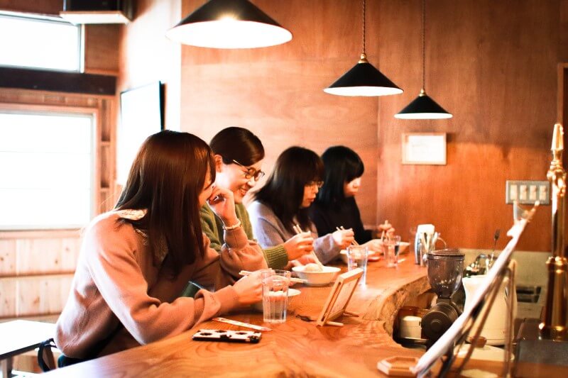 japanese friends dining in restaurant