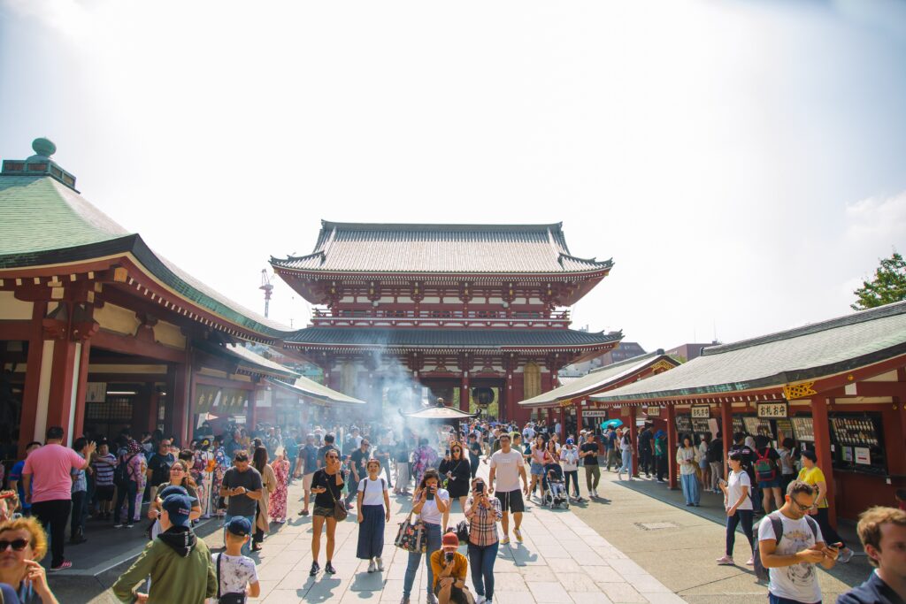 Japanese Omiyage 8 The front of a Japanese temple on a beautiful day with a bustling crowd of visitors