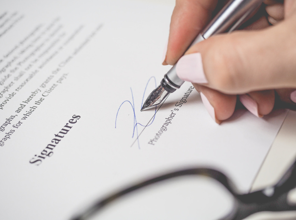 Important business document signing with pen