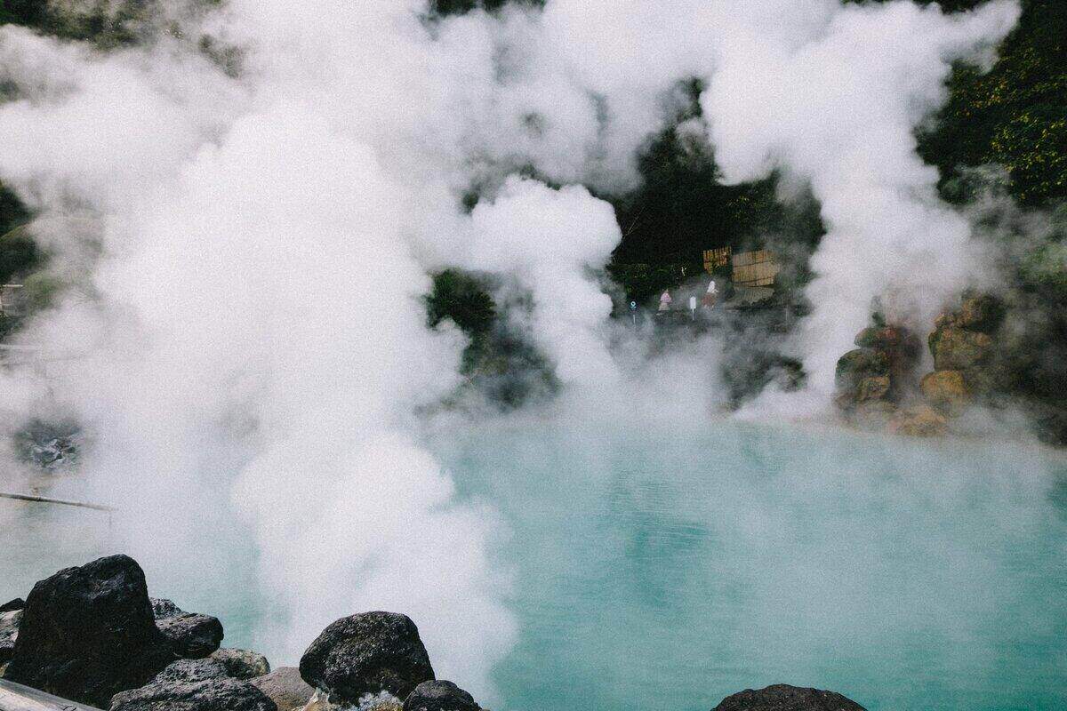 A picture of steams coming out of an onsen