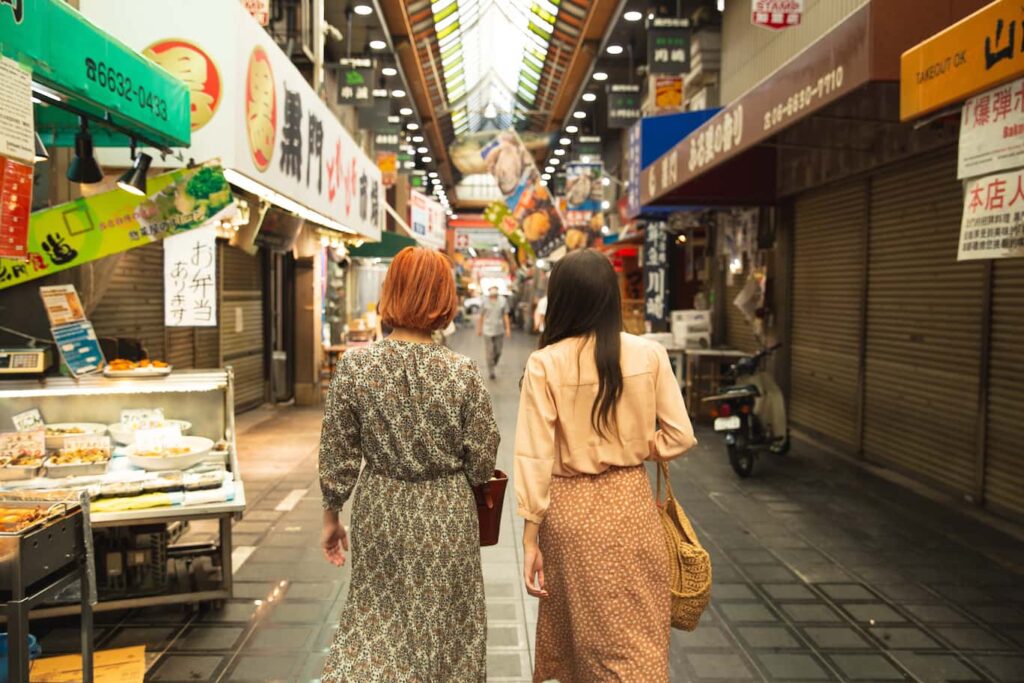 Japan Sightseeing 1 Two women walking through the streets of Japan Sightseeing in Osaka
