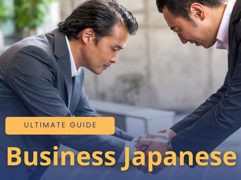 Two businessmen bowing to one another