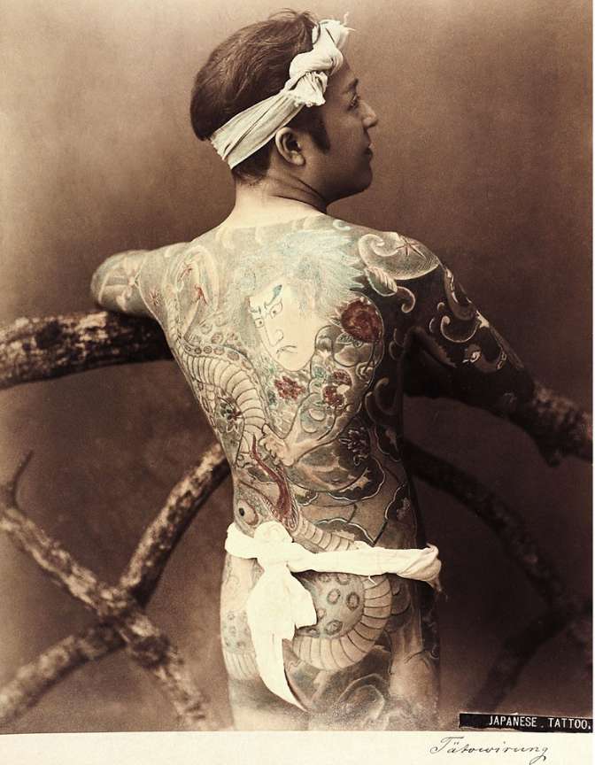 Tokyo Tattoo 1 Old photo of Japanese man showing back covered in tattoos