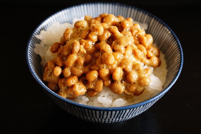weird japanese foods natto natto over rice in a bowl, a sticky and weird japanese food